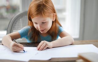 young child dealing with aparixa while doing homework